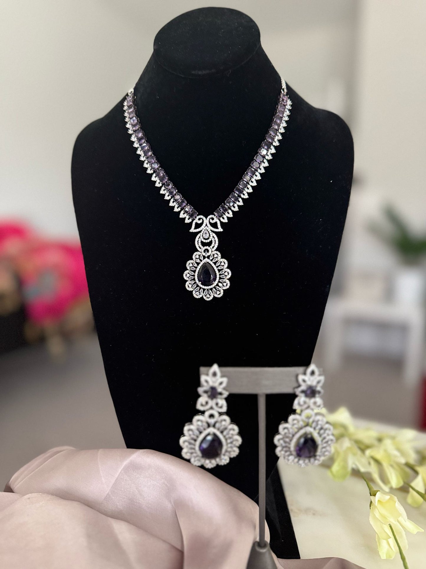 Elegant Silver Plated Stone Studded Floral Design Pendant Necklace Set with Drop Earrings